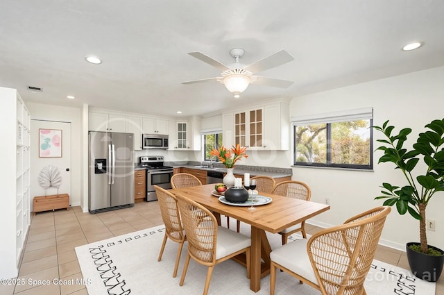 380 N 2nd St, Cocoa Beach, FL 32931 - dining space with light tile patterned floors, ceiling fan, and recessed lighting