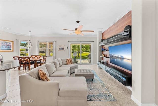 366 Gardendale Cir SE, Palm Bay, FL 32909 - living area with baseboards, ceiling fan, and crown molding