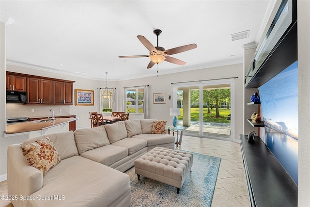 366 Gardendale Cir SE, Palm Bay, FL 32909 - living area featuring crown molding, ceiling fan, visible vents, and light tile patterned floors