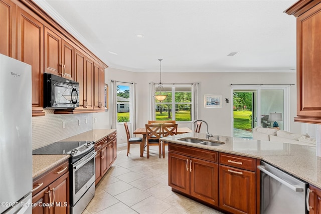 366 Gardendale Cir SE, Palm Bay, FL 32909 - kitchen featuring backsplash, a sink, appliances with stainless steel finishes, and a wealth of natural light
