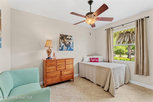 366 Gardendale Cir SE, Palm Bay, FL 32909 - bedroom featuring baseboards, light tile patterned floors, and a ceiling fan