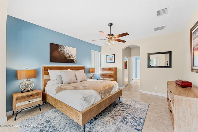 366 Gardendale Cir SE, Palm Bay, FL 32909 - bedroom with a ceiling fan, arched walkways, baseboards, and visible vents