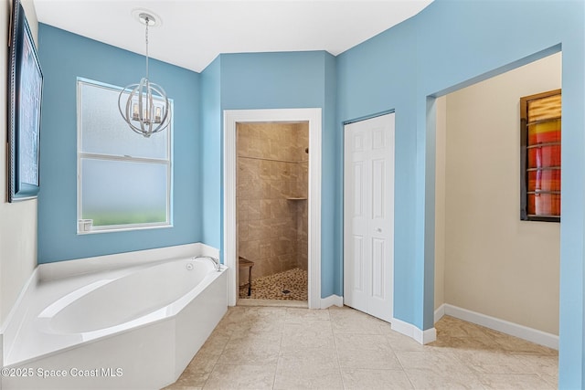 366 Gardendale Cir SE, Palm Bay, FL 32909 - full bath featuring a bath, a chandelier, baseboards, tile patterned floors, and tiled shower