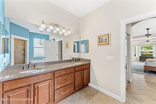 366 Gardendale Cir SE, Palm Bay, FL 32909 - full bath with double vanity, a sink, baseboards, and ceiling fan