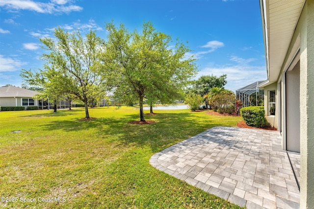 366 Gardendale Cir SE, Palm Bay, FL 32909 - view of yard with glass enclosure and a patio area