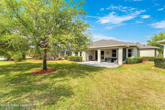 366 Gardendale Cir SE, Palm Bay, FL 32909 - back of house featuring a patio, a shingled roof, a lawn, and stucco siding