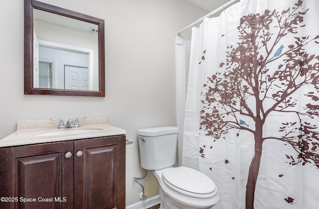 2880 Fountainhead Blvd, Melbourne, FL 32935 - full bath featuring toilet, vanity, baseboards, and a shower with curtain