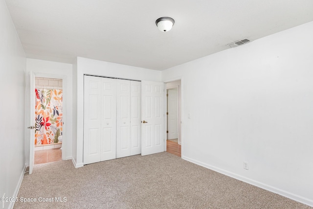 2880 Fountainhead Blvd, Melbourne, FL 32935 - unfurnished bedroom with carpet, baseboards, and a closet