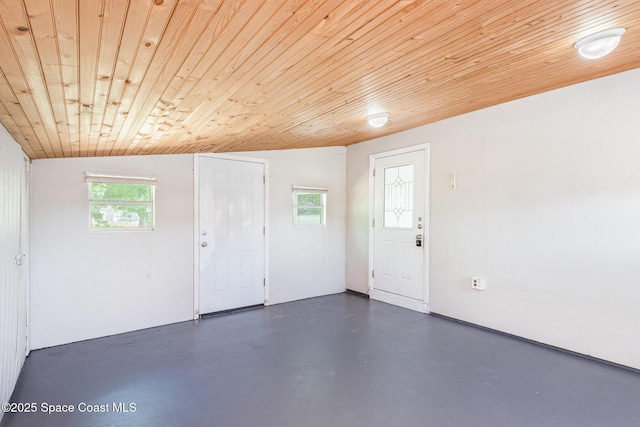 2880 Fountainhead Blvd, Melbourne, FL 32935 - entrance foyer featuring wooden ceiling, finished concrete flooring, and vaulted ceiling