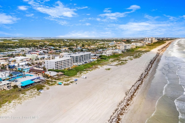 bird's eye view featuring a water view and a view of the beach