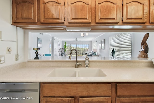 540 S Brevard Ave Unit 427, Cocoa Beach, FL 32931 - kitchen featuring dishwasher, light countertops, brown cabinets, and ceiling fan