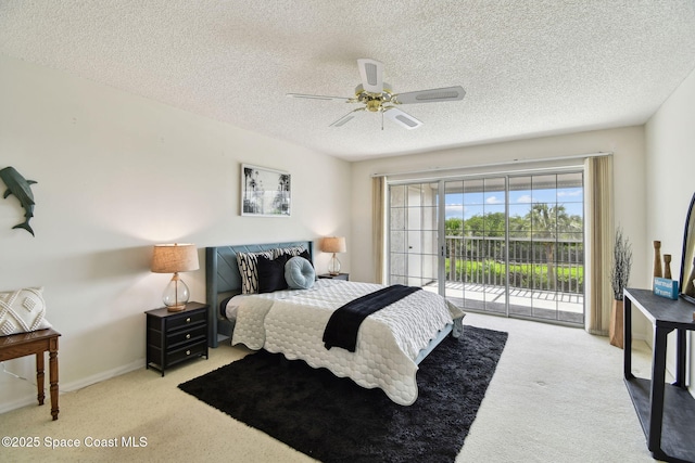 540 S Brevard Ave Unit 427, Cocoa Beach, FL 32931 - carpeted bedroom with access to outside, a textured ceiling, and a ceiling fan