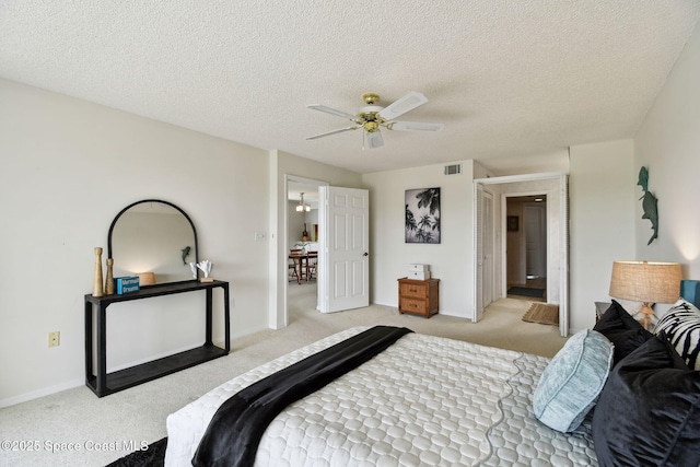 540 S Brevard Ave Unit 427, Cocoa Beach, FL 32931 - bedroom featuring light colored carpet, a textured ceiling, and ceiling fan