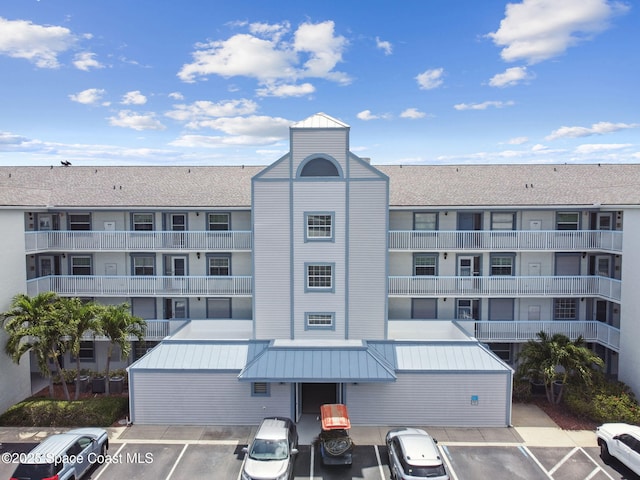 540 S Brevard Ave Unit 427, Cocoa Beach, FL 32931 - view of apartment building / complex with uncovered parking
