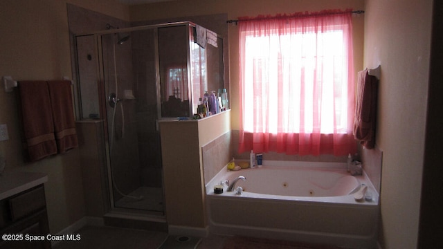 112 Broyles Dr SE, Palm Bay, FL 32909 - full bath with a wealth of natural light, a shower stall, a jetted tub, and vanity