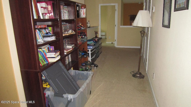 112 Broyles Dr SE, Palm Bay, FL 32909 - hall with baseboards and carpet floors