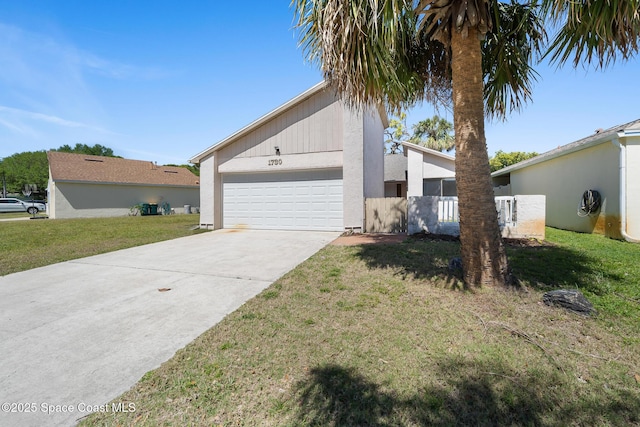 1730 Bluebird Ct, Melbourne, FL 32935 - view of property exterior featuring concrete driveway, a garage, fence, and a lawn