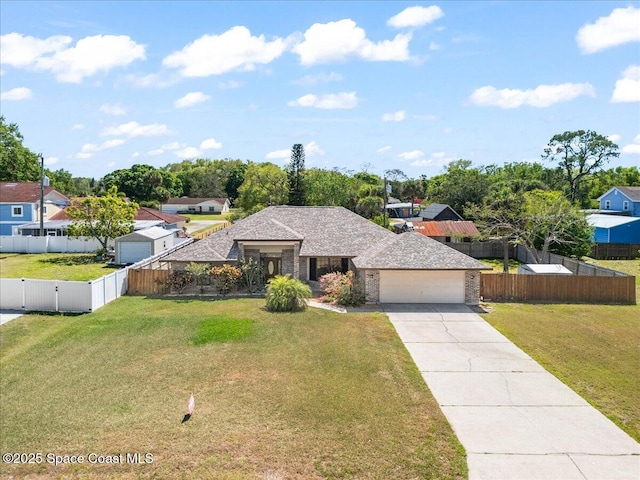 view of front of house featuring a gate, a garage, a front lawn, driveway, and fence private yard