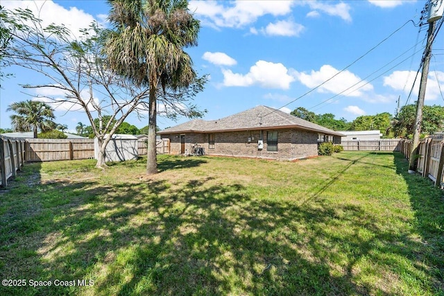 view of yard featuring a fenced backyard
