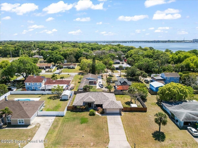 birds eye view of property with a residential view and a water view