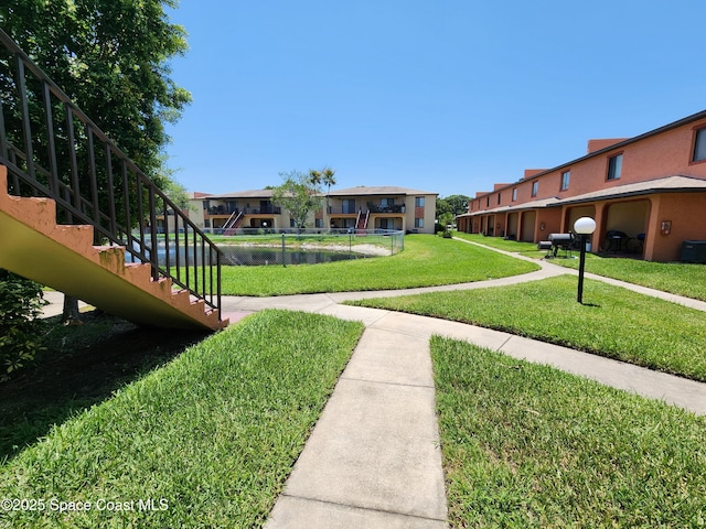 120 San Juan Cir, Melbourne, FL 32935 - view of property's community featuring stairway, a lawn, and a residential view