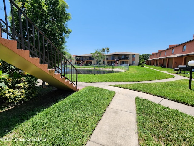 120 San Juan Cir, Melbourne, FL 32935 - view of community with a residential view, stairs, and a yard