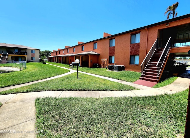 120 San Juan Cir, Melbourne, FL 32935 - view of home's community with a lawn and stairs