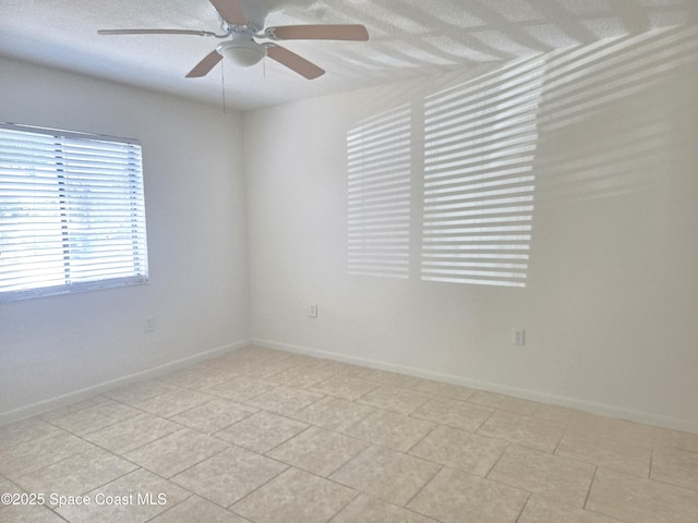 120 San Juan Cir, Melbourne, FL 32935 - empty room with a ceiling fan, baseboards, and a textured ceiling
