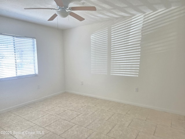 120 San Juan Cir, Melbourne, FL 32935 - empty room with a textured ceiling, baseboards, and ceiling fan