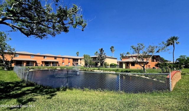 120 San Juan Cir, Melbourne, FL 32935 - view of front facade with a front yard and fence