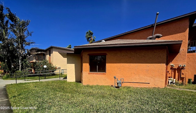 120 San Juan Cir, Melbourne, FL 32935 - view of side of property featuring a yard and stucco siding