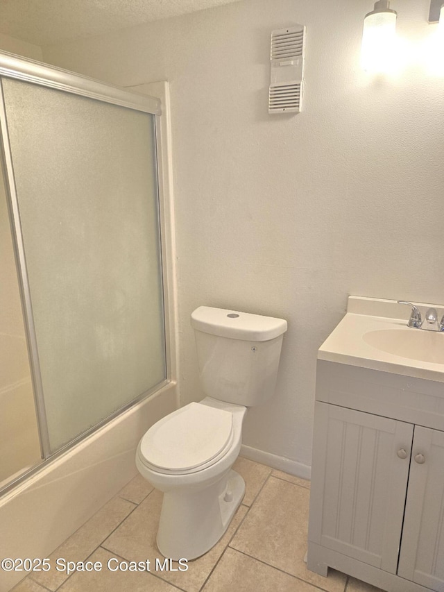 120 San Juan Cir, Melbourne, FL 32935 - full bathroom with tile patterned flooring, visible vents, toilet, enclosed tub / shower combo, and vanity