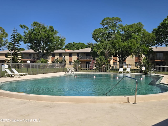 120 San Juan Cir, Melbourne, FL 32935 - community pool featuring a patio and fence