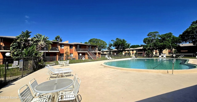 120 San Juan Cir, Melbourne, FL 32935 - community pool with a patio and fence
