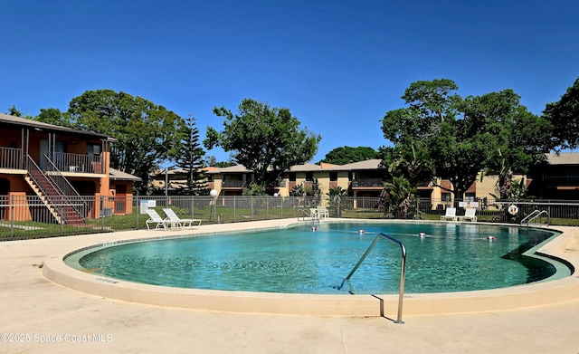 120 San Juan Cir, Melbourne, FL 32935 - community pool featuring a patio and fence