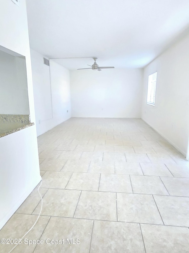 120 San Juan Cir, Melbourne, FL 32935 - empty room featuring light tile patterned floors, visible vents, and a ceiling fan