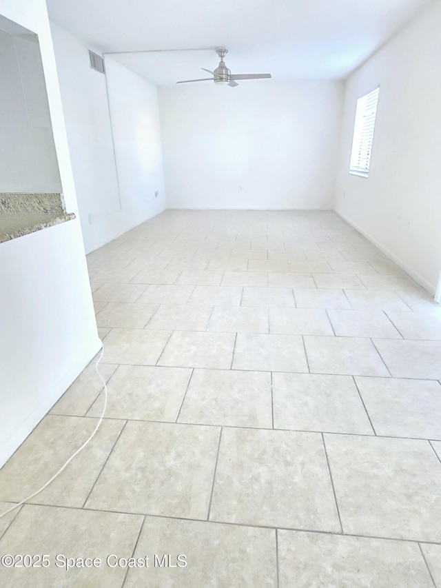 120 San Juan Cir, Melbourne, FL 32935 - unfurnished room with light tile patterned floors, a ceiling fan, and visible vents