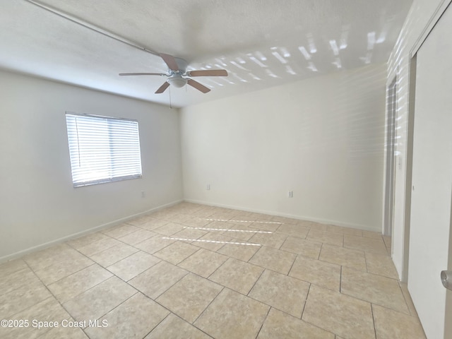 120 San Juan Cir, Melbourne, FL 32935 - unfurnished room with baseboards, ceiling fan, and light tile patterned flooring