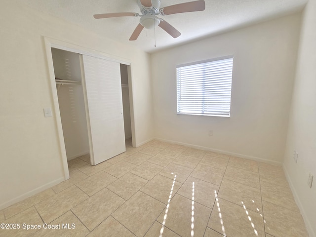 120 San Juan Cir, Melbourne, FL 32935 - unfurnished bedroom with light tile patterned flooring, baseboards, and a closet