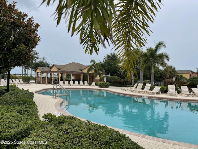 785 Luminary Cir Unit 103, Melbourne, FL 32901 - community pool with a patio area
