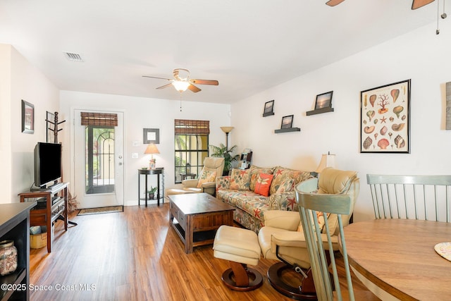 785 Luminary Cir Unit 103, Melbourne, FL 32901 - living room featuring a ceiling fan and light wood-type flooring