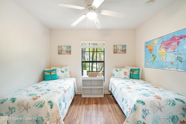 785 Luminary Cir Unit 103, Melbourne, FL 32901 - bedroom with wood finished floors and ceiling fan