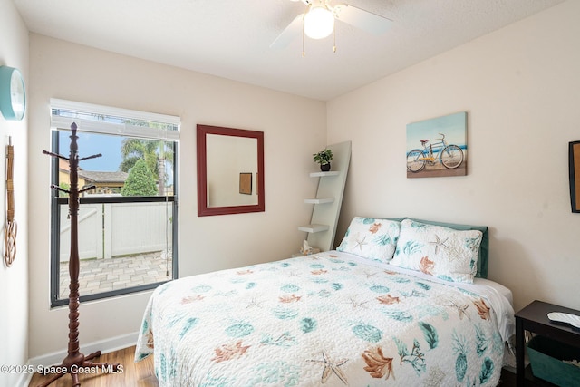 785 Luminary Cir Unit 103, Melbourne, FL 32901 - bedroom with wood finished floors, ceiling fan, and baseboards