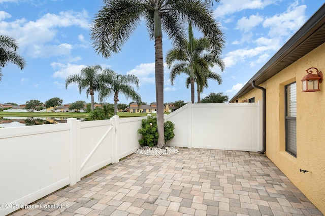785 Luminary Cir Unit 103, Melbourne, FL 32901 - fenced backyard featuring a gate and a patio area