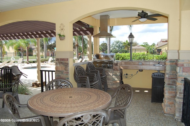 785 Luminary Cir Unit 103, Melbourne, FL 32901 - view of patio / terrace with ceiling fan, a swimming pool, and outdoor dining space