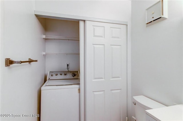 laundry room featuring washer / dryer and laundry area