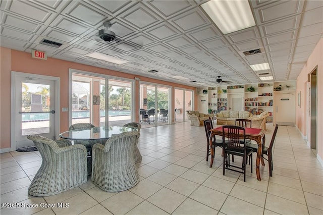 dining area featuring visible vents, an ornate ceiling, and light tile patterned flooring