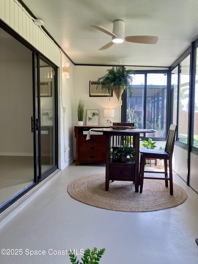 sunroom / solarium featuring an AC wall unit