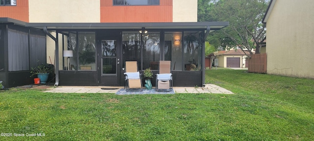 entrance to property featuring a lawn