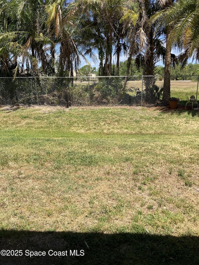 view of yard featuring fence